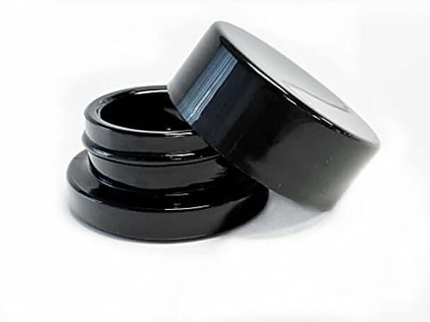 9ml round black glass concentrate jars with a child-resistant lid, ideal for safe storage of oils and waxes.