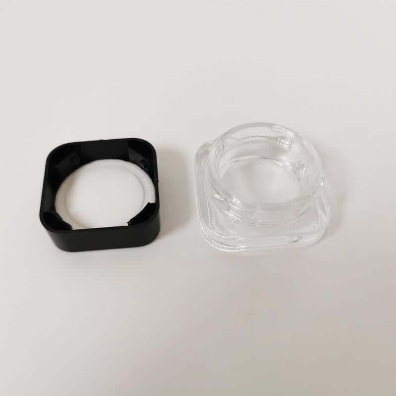 5 ML square clear glass jar with black lid, perfect for packaging concentrates, oils, and cosmetics.
