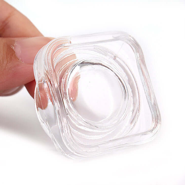 5 ML square clear glass jar being held, showcasing its compact design and crystal clarity for premium packaging.