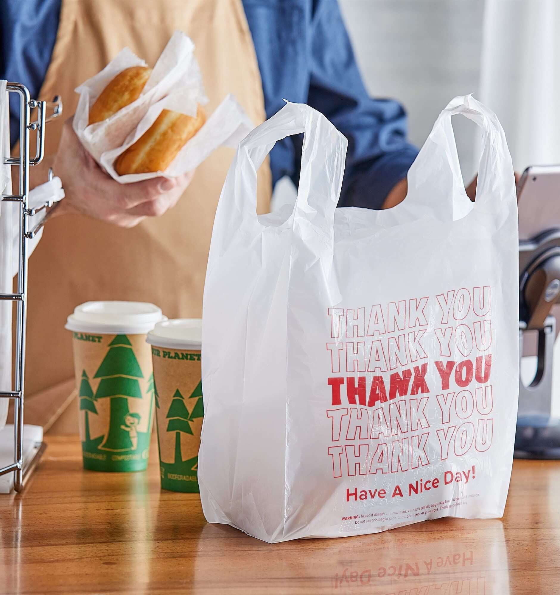 Pack of thank you plastic bags with 'Have A Nice Day' message, ideal for retail and takeaway items.
